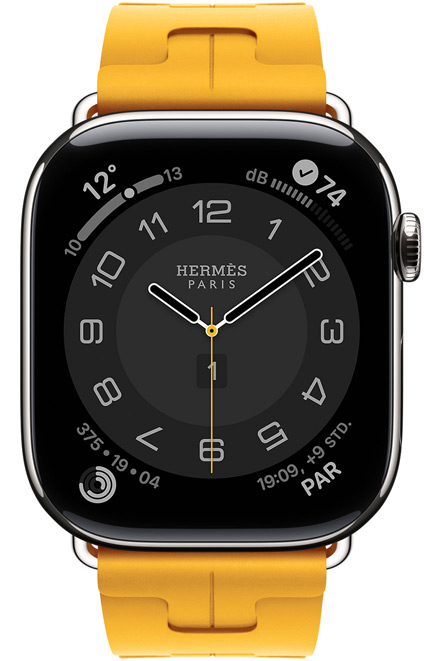 Apple Watch Hermès Series 11, Circulaire Zifferblatt (Stunden-, Minuten- und Sekundenzeiger, Hermès Paris Logo, Komplikationen: Wetter, Aktivitätsringe, Paris Zeit und UV Index), Titangehäuse, Farbe Silber, rechte Seite, Digital Crown, kombiniert mit Kilim Single Tour Armband, Farbe Jaune (Kanariengelb), Material aus Fluorelastomergummi