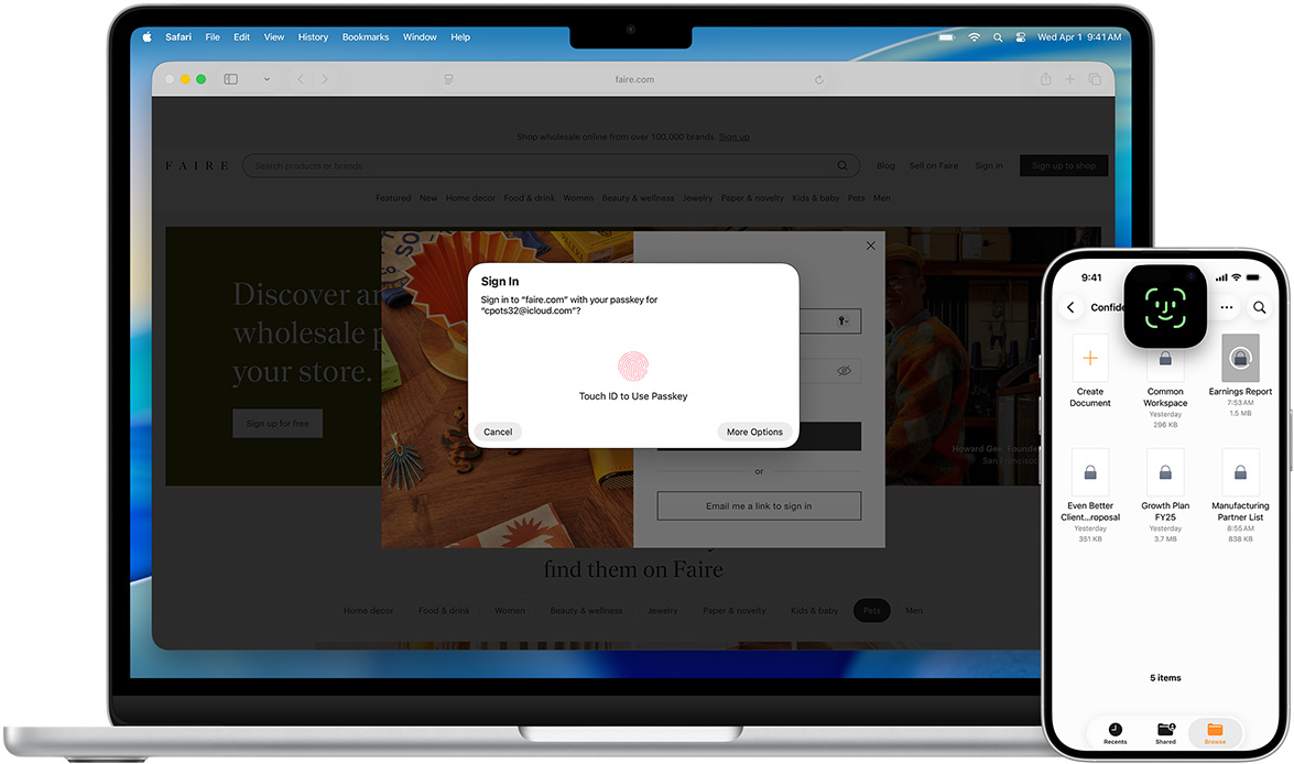 Tampilan depan MacBook yang memperlihatkan jendela Touch ID. Di depan MacBook terdapat iPhone yang memperlihatkan layar Face ID.