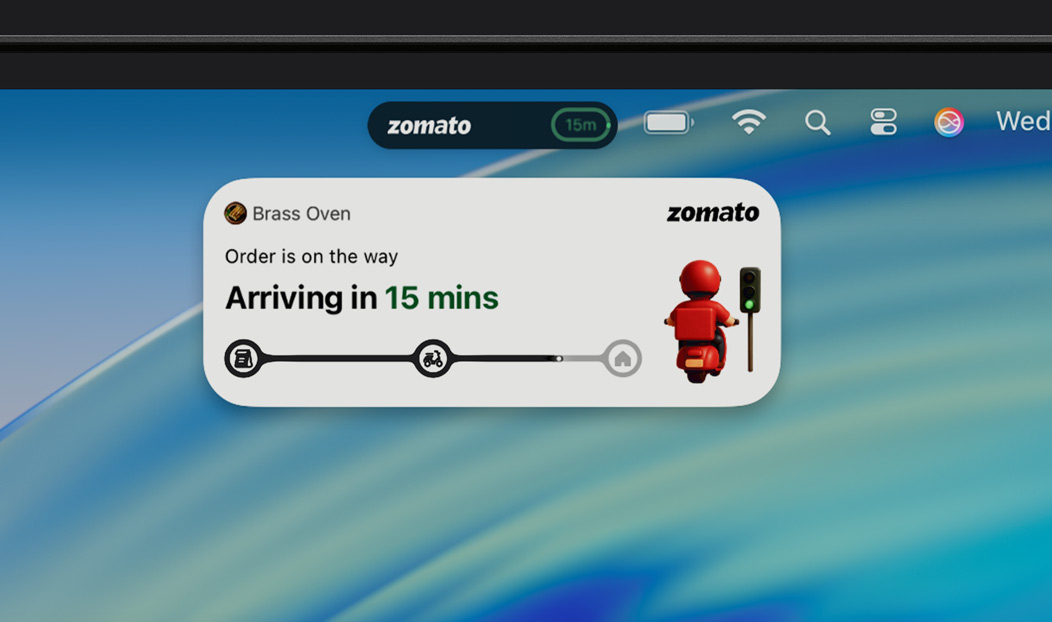 MacBook Pro, Live Activity notification shows an Uber Eats is on the way