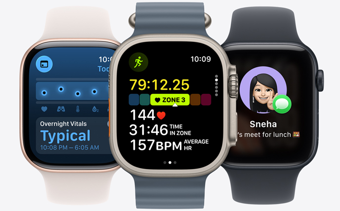 Three Apple Watch models, center in Natural colour, face shows run in progress with heart rate stats, right in Jet Black, face with Genmoji, left in Rose Gold, face shows Vitals