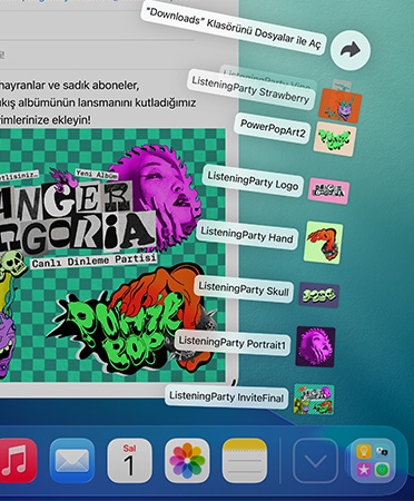 Alt kısımda yer alan ve bir dizi dosyanın yelpaze şeklinde açılarak yukarı doğru çıktığı Dock’un yakından görüntüsü