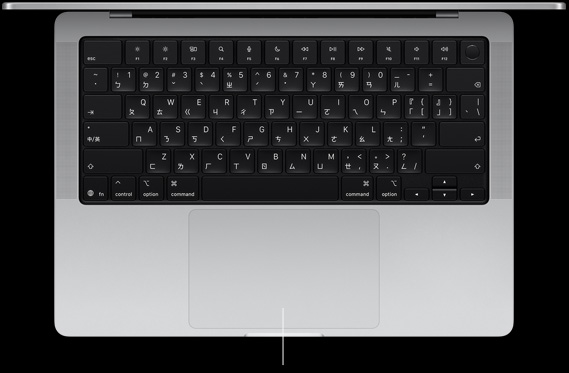 打開的 MacBook Pro 14 吋俯視圖，展示位於鍵盤下方的力度觸控板