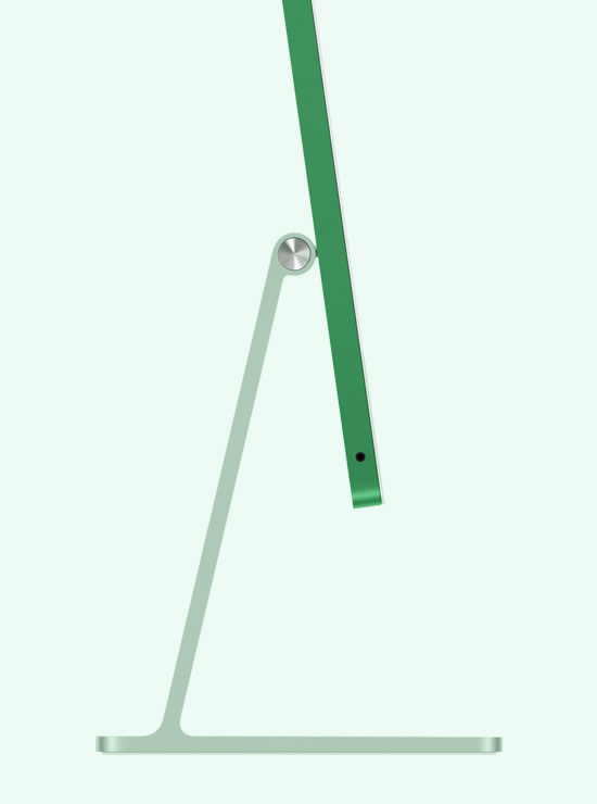 Skats no sāna uz zaļu iMac