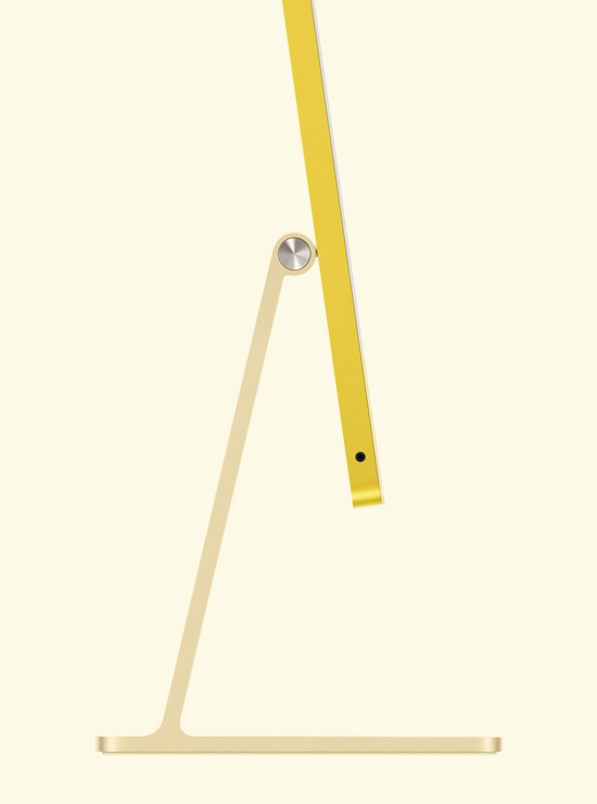 Skats no sāna uz dzeltenu iMac