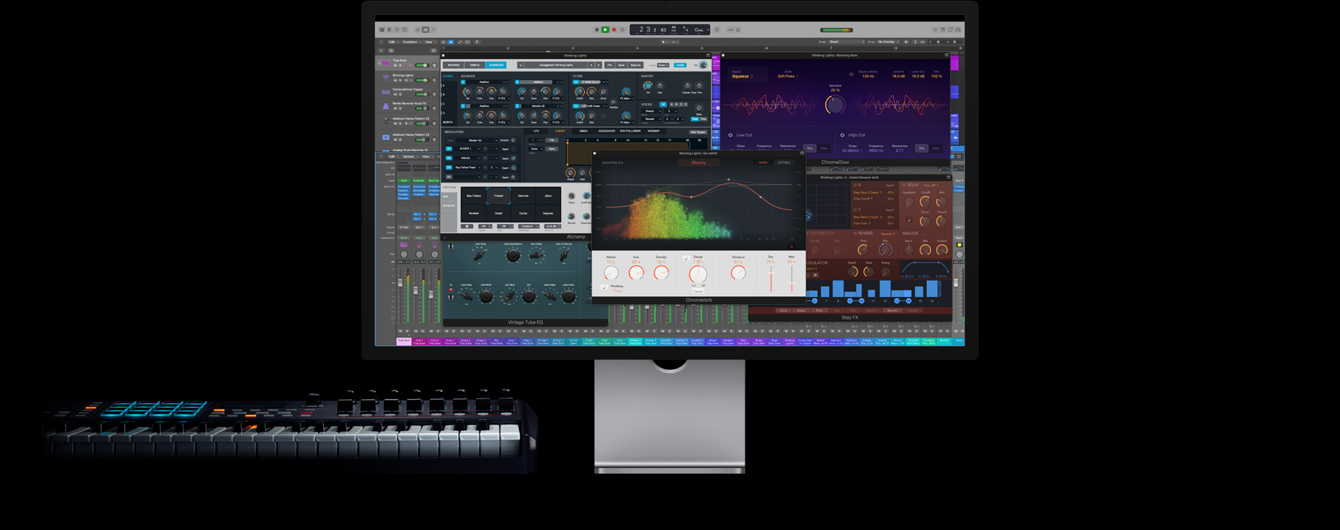 Mac Studio Display, screen of Logic Pro controls, keyboard on the bottom left side