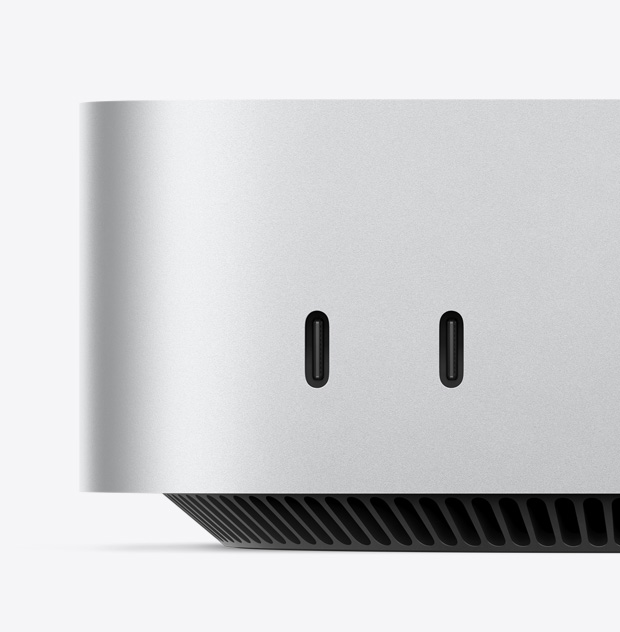 Mac mini priekšā izvietoto USB‑C portu tuvplāns