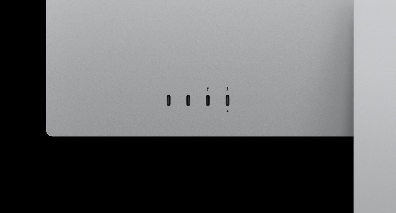 Studio Display XDR aizmugure tuvplānā, izceļot divus USB-C portus un divus Thunderbolt 5 portus